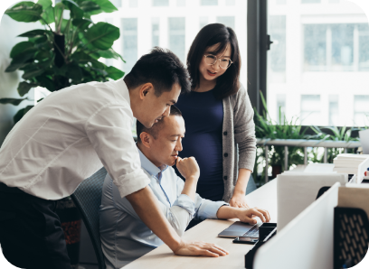 People at office around a computer