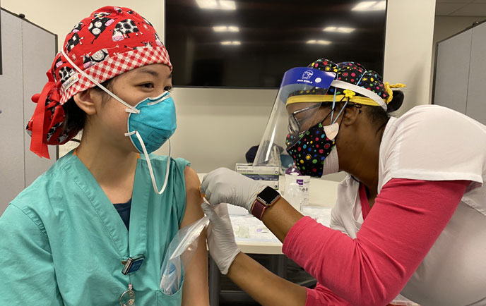 Hospital employee getting vaccination