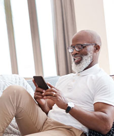 older man with mobile device
