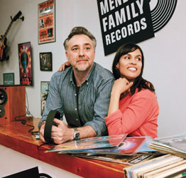 couple at counter of record store