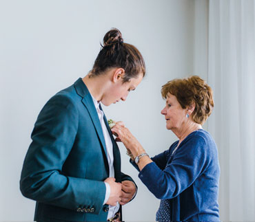grandmother helping with boutonniere