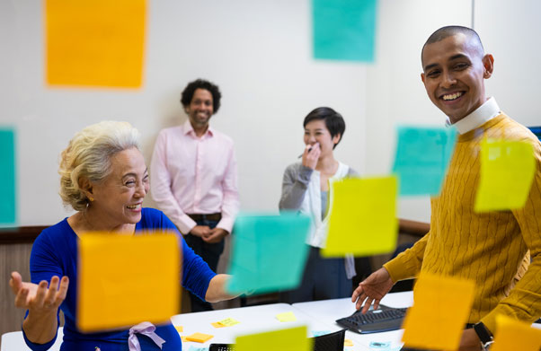 People having a meeting with sticky notes