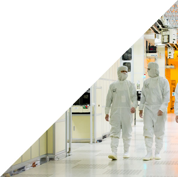 Two people walking in technology clean room