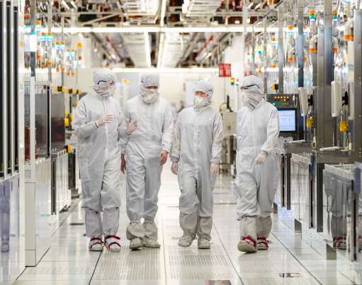 Four people in technology clean room